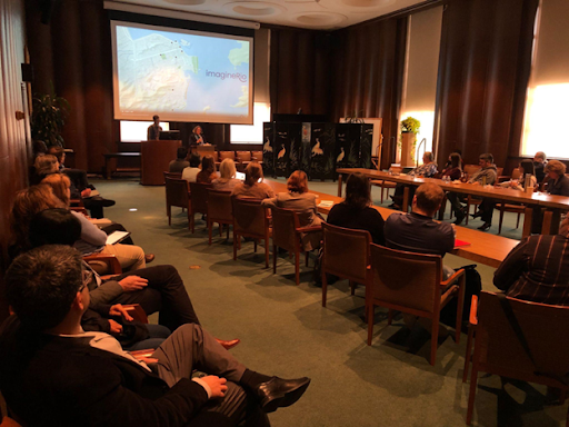 Attendees look on as Alida Metcalf and Bruno Buccalon present on the ImagineRio project in Fondren’s Kyle Morrow Room.