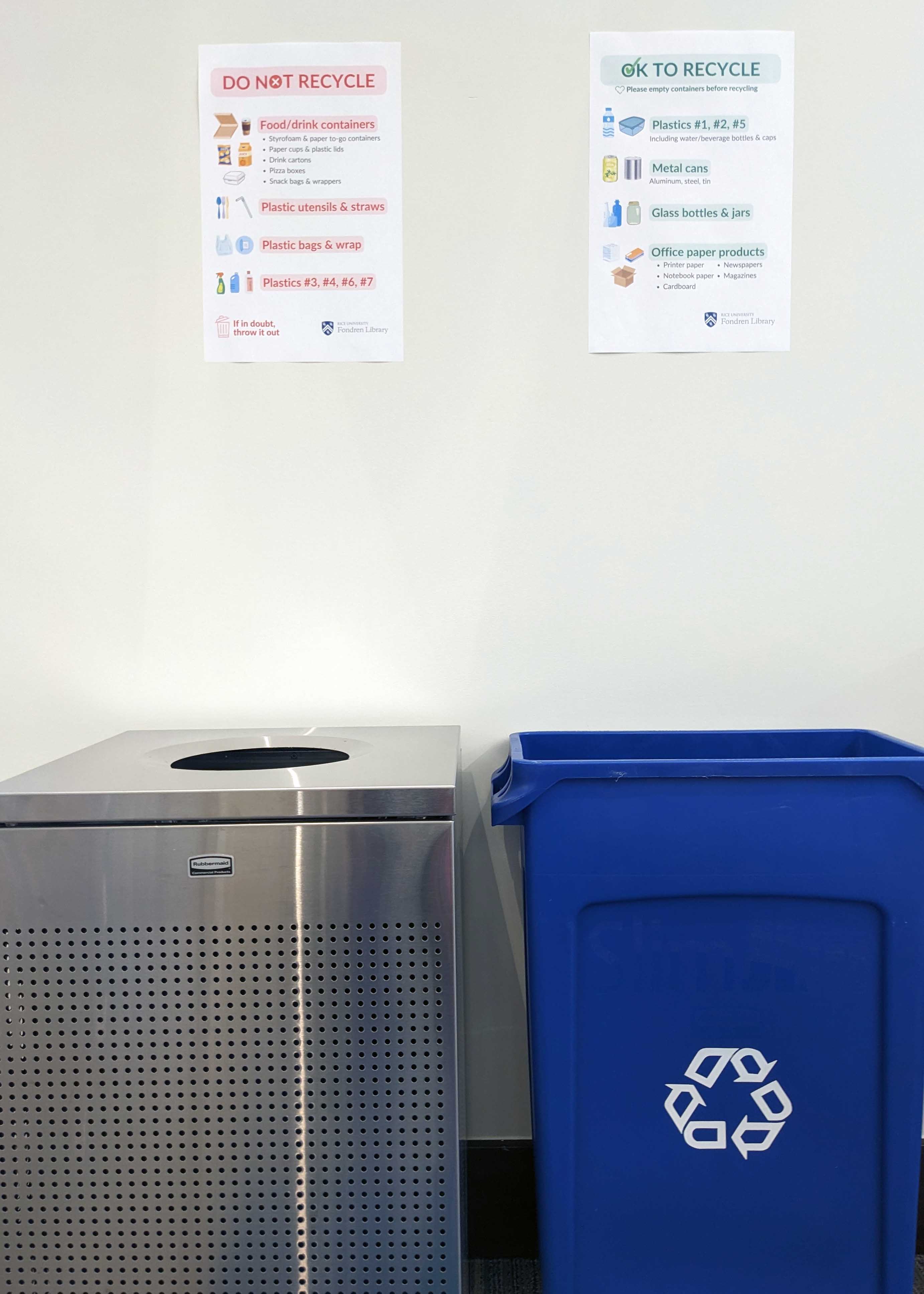 Recycling and trash bins with new signs